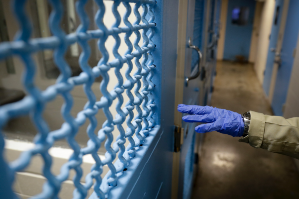 Break Out of Jail: COVID-19 Outbreaks within the Prison System